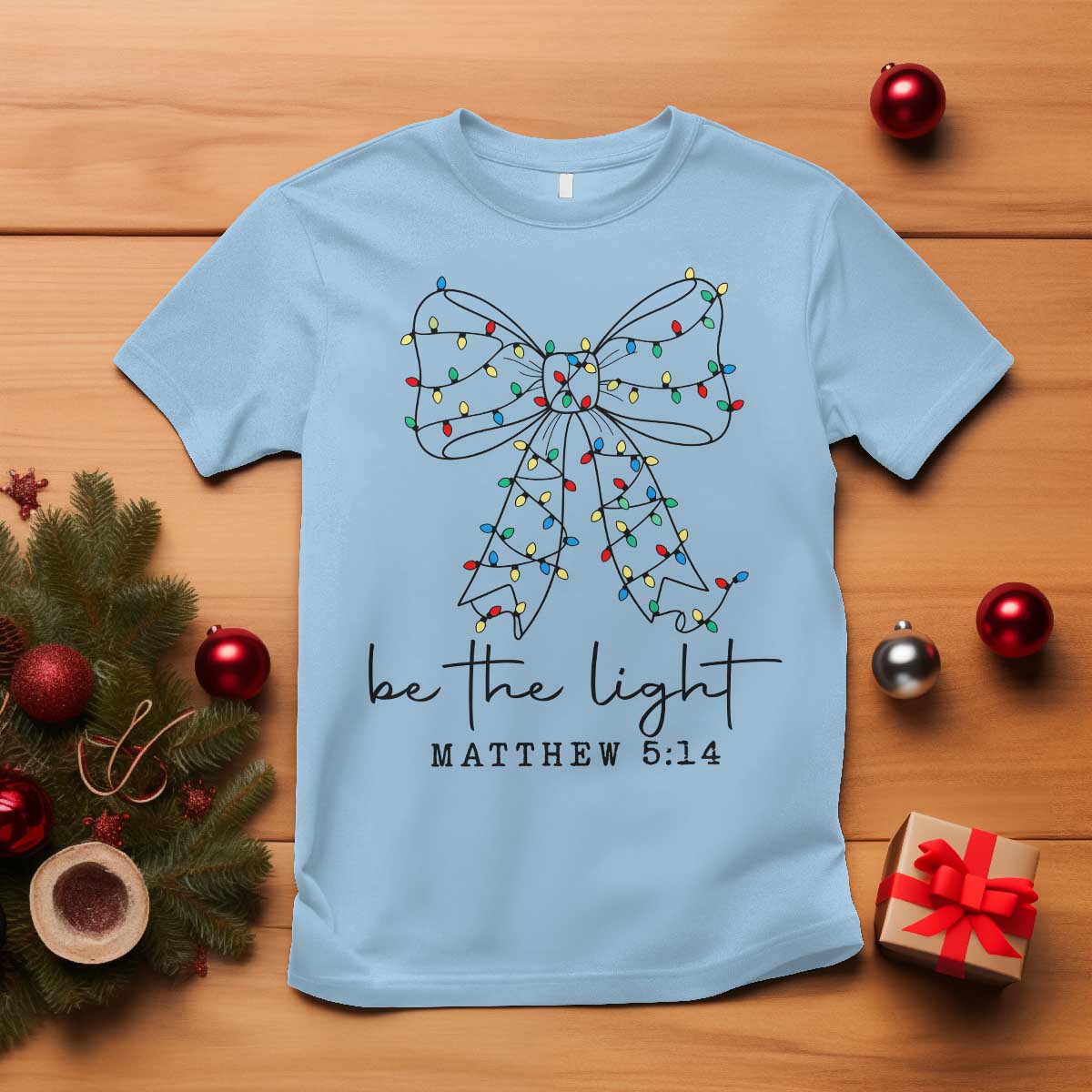 Be The Light Christmas Coquette Bow T Shirt Christian Religious Bible Verse TS10 Light Blue Print Your Wear