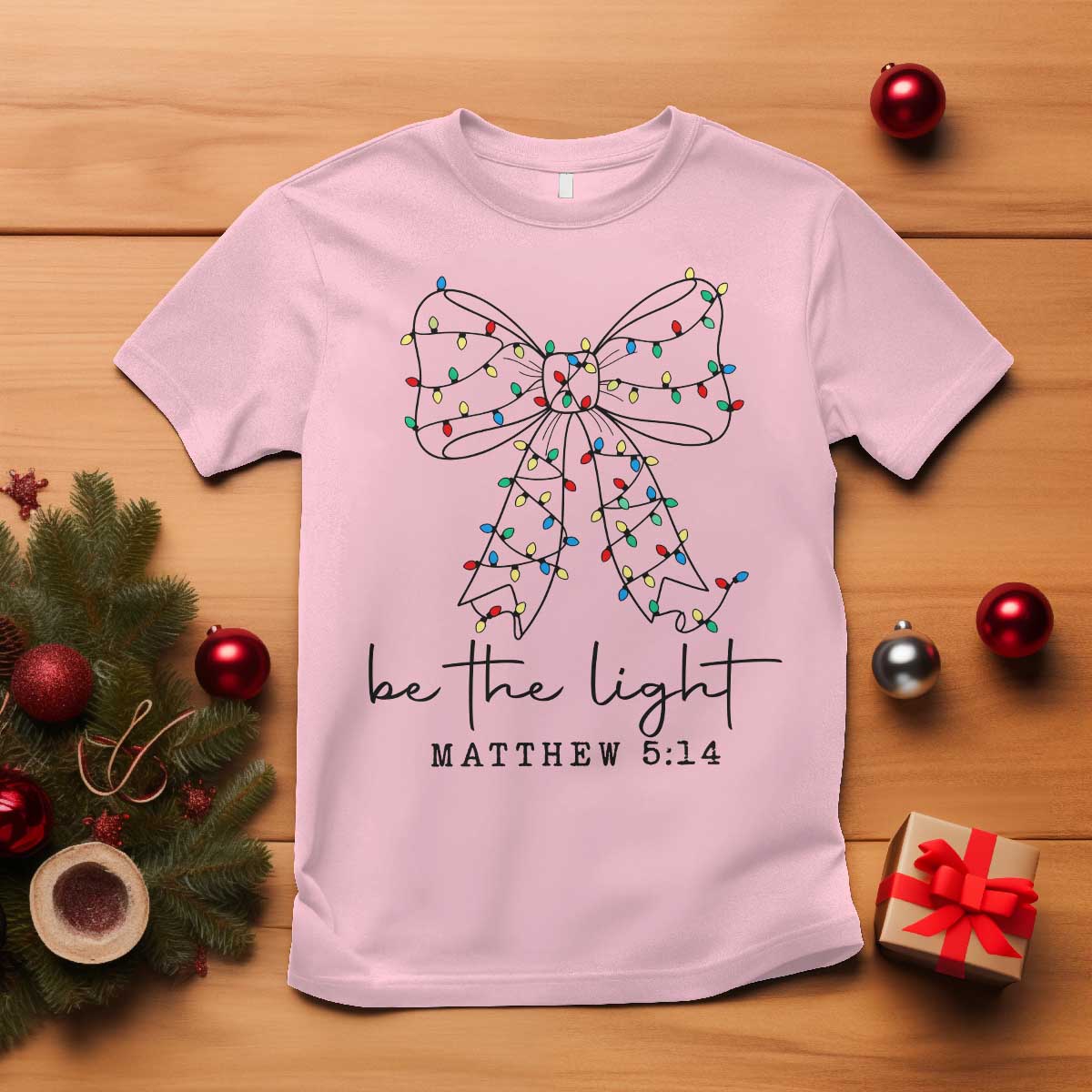 Be The Light Christmas Coquette Bow T Shirt Christian Religious Bible Verse TS10 Light Pink Print Your Wear