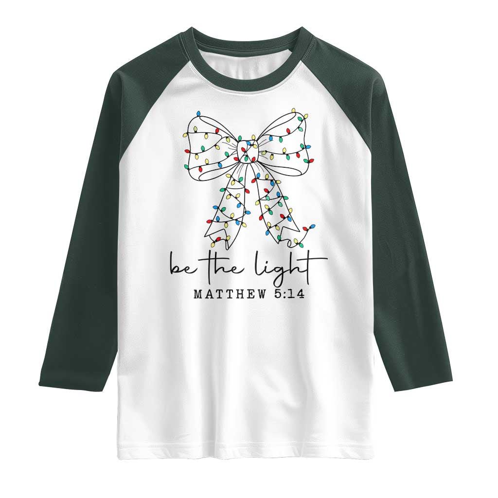 Be The Light Christmas Coquette Bow Raglan Shirt Christian Religious Bible Verse TS10 White Dark Forest Green Print Your Wear
