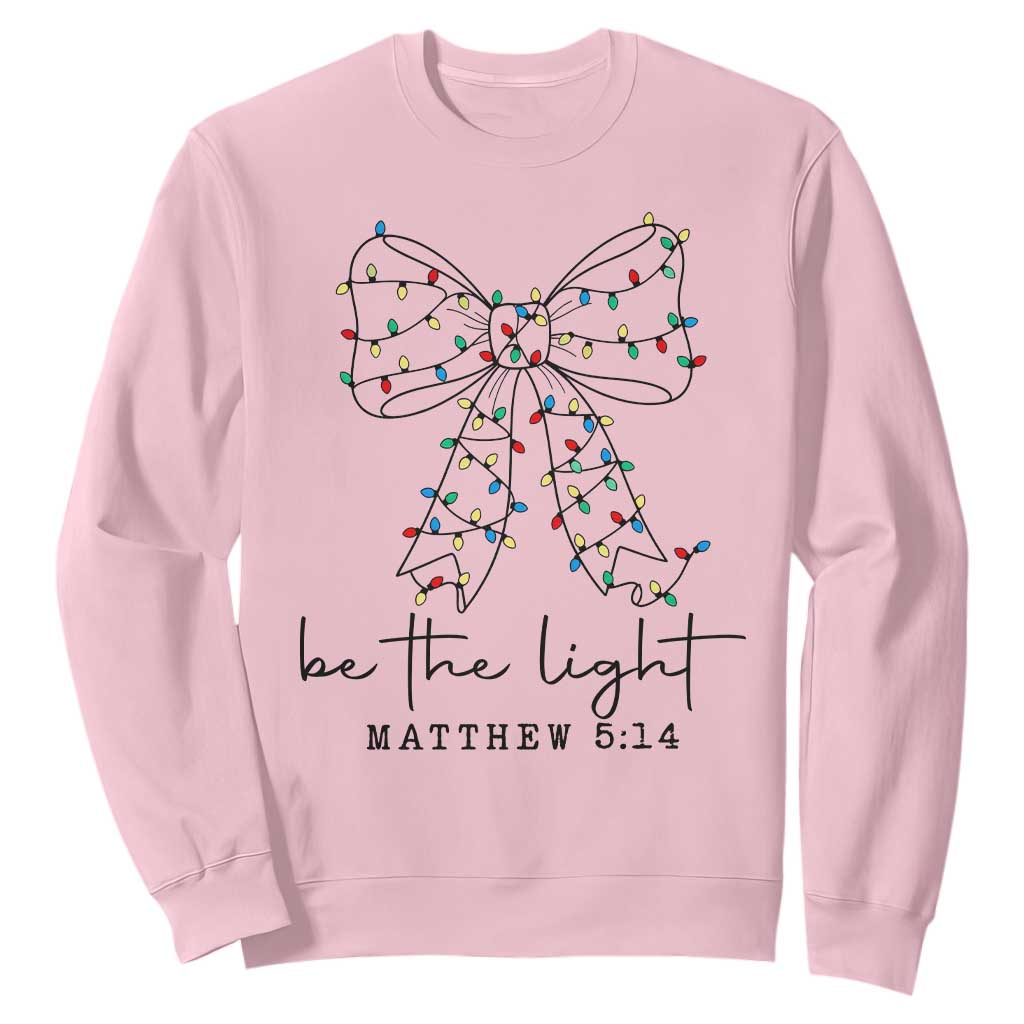 Be The Light Christmas Coquette Bow Sweatshirt Christian Religious Bible Verse TS10 Light Pink Print Your Wear