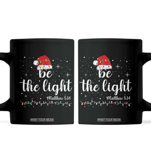 Be The Light Christmas Coffee Mug Christian Religious Bible Verse Santa Hat Pajama TS10 Black Print Your Wear