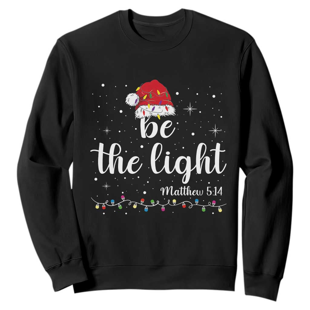 Be The Light Christmas Sweatshirt Christian Religious Bible Verse Santa Hat Pajama TS10 Black Print Your Wear
