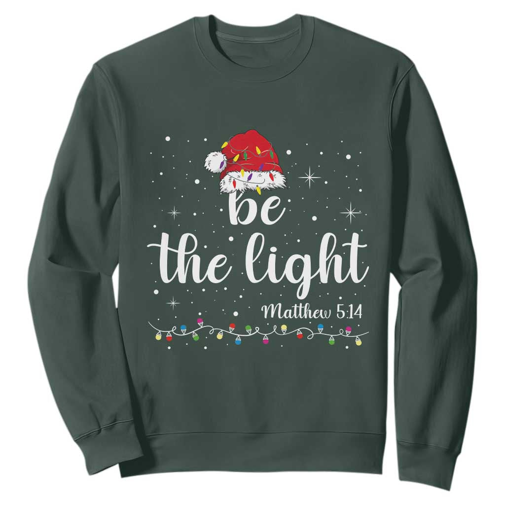 Be The Light Christmas Sweatshirt Christian Religious Bible Verse Santa Hat Pajama TS10 Dark Forest Green Print Your Wear