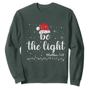 Be The Light Christmas Sweatshirt Christian Religious Bible Verse Santa Hat Pajama TS10 Dark Forest Green Print Your Wear