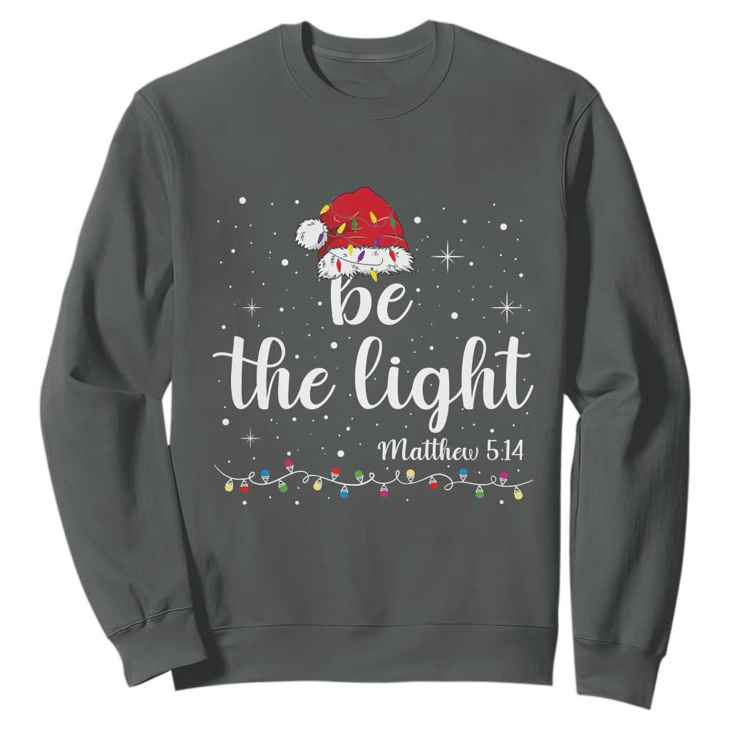Be The Light Christmas Sweatshirt Christian Religious Bible Verse Santa Hat Pajama TS10 Dark Heather Print Your Wear