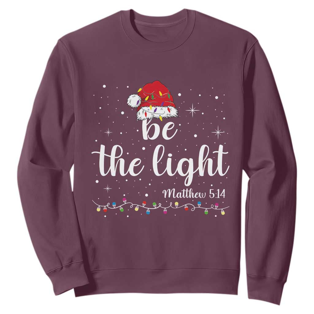 Be The Light Christmas Sweatshirt Christian Religious Bible Verse Santa Hat Pajama TS10 Maroon Print Your Wear