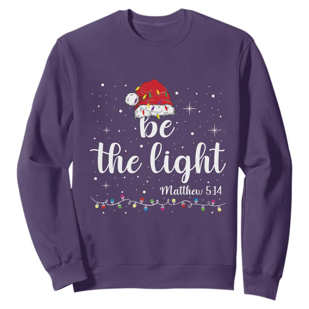 Be The Light Christmas Sweatshirt Christian Religious Bible Verse Santa Hat Pajama TS10 Purple Print Your Wear