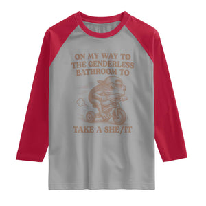 On My Way To The Genderless Bathroom To Take a She/It Raglan Shirt Funny Frog Graphic