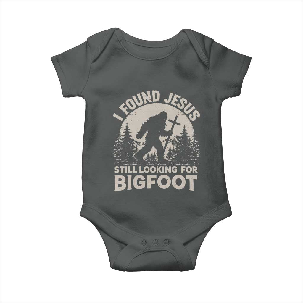 I Found Jesus Still Looking For Bigfoot Baby Onesie Funny Christian Sasquatch Forest TS11 Dark Heather Print Your Wear