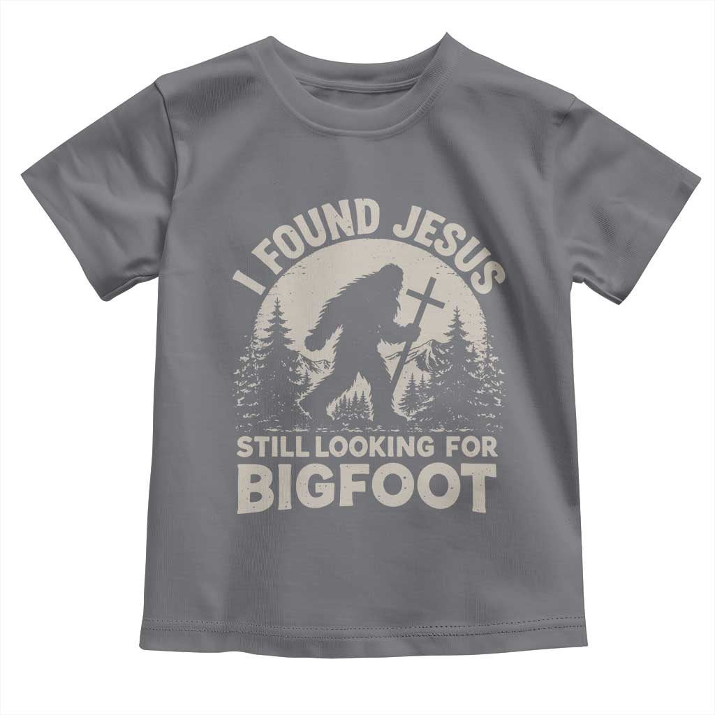 I Found Jesus Still Looking For Bigfoot Toddler T Shirt Funny Christian Sasquatch Forest TS11 Charcoal Print Your Wear