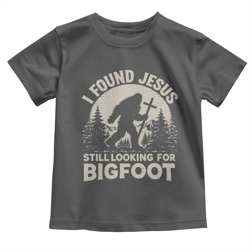 I Found Jesus Still Looking For Bigfoot Toddler T Shirt Funny Christian Sasquatch Forest TS11 Dark Heather Print Your Wear