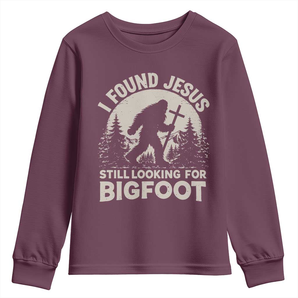 I Found Jesus Still Looking For Bigfoot Youth Sweatshirt Funny Christian Sasquatch Forest TS11 Maroon Print Your Wear