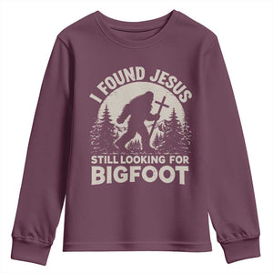I Found Jesus Still Looking For Bigfoot Youth Sweatshirt Funny Christian Sasquatch Forest TS11 Maroon Print Your Wear