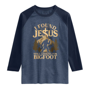 I Found Jesus Still Looking For Bigfoot Raglan Shirt Funny Christian Sasquatch Vintage Mountain TS11 Heather Denim Navy Print Your Wear