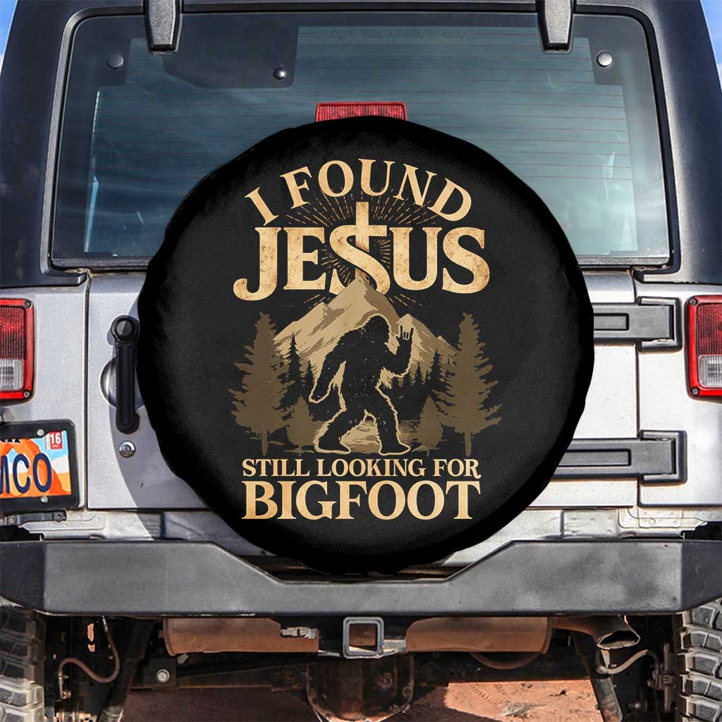 I Found Jesus Still Looking For Bigfoot Spare Tire Cover Funny Christian Sasquatch Vintage Mountain TS11 No hole Black Print Your Wear