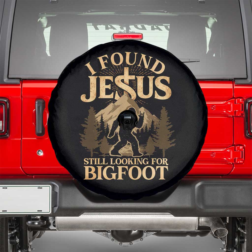 I Found Jesus Still Looking For Bigfoot Spare Tire Cover Funny Christian Sasquatch Vintage Mountain TS11 Black Print Your Wear