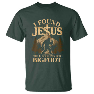 I Found Jesus Still Looking For Bigfoot T Shirt Funny Christian Sasquatch Vintage Mountain TS11 Dark Forest Green Print Your Wear