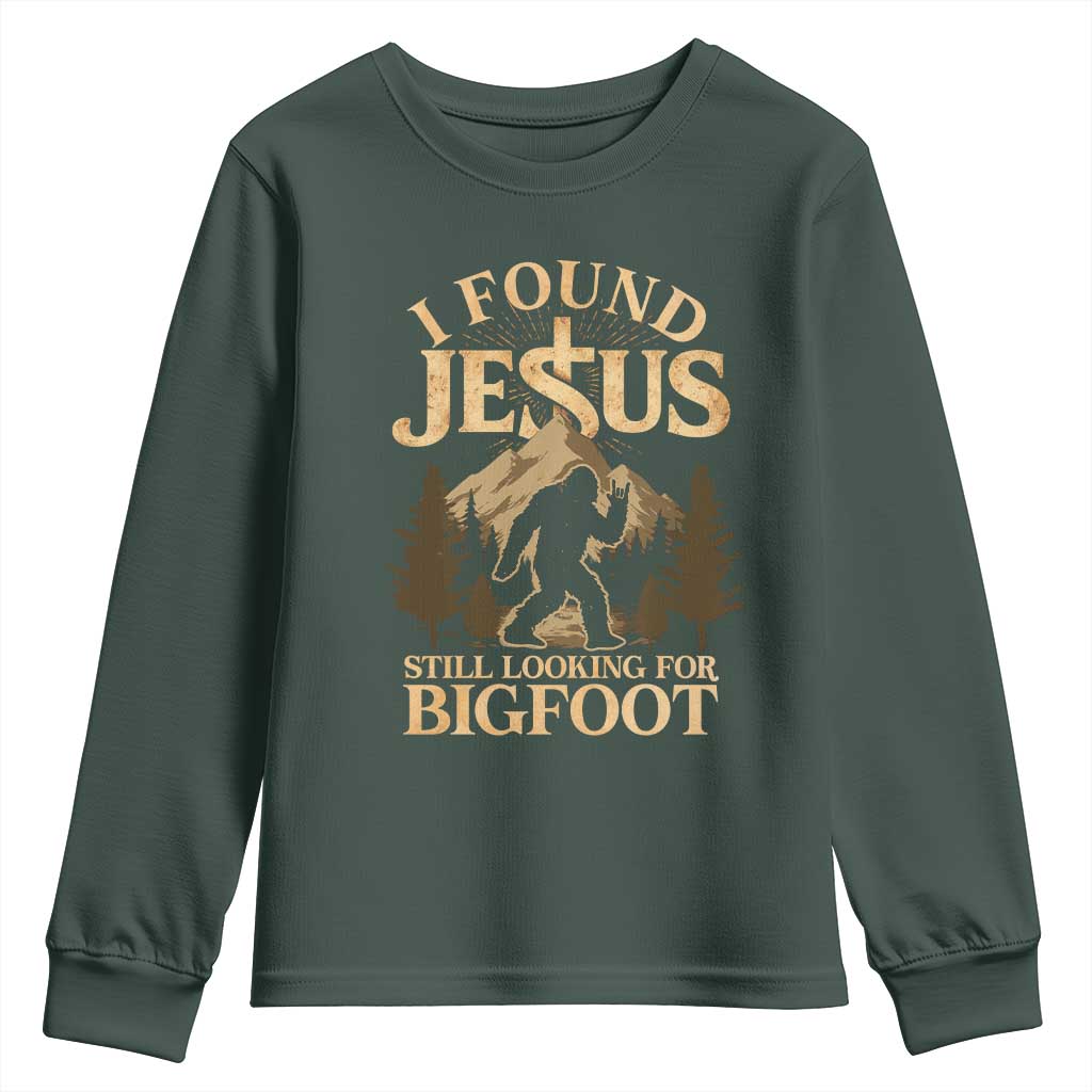 I Found Jesus Still Looking For Bigfoot Youth Sweatshirt Funny Christian Sasquatch Vintage Mountain TS11 Dark Forest Green Print Your Wear