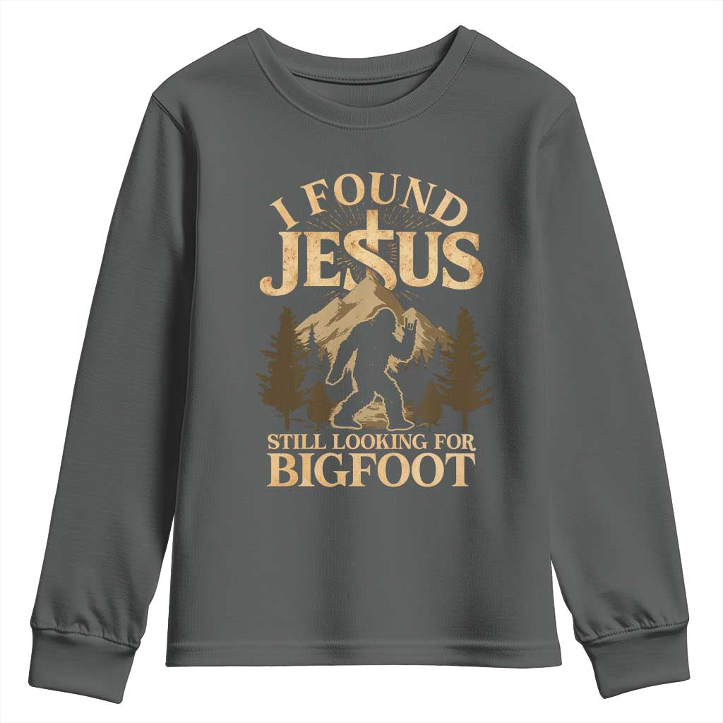 I Found Jesus Still Looking For Bigfoot Youth Sweatshirt Funny Christian Sasquatch Vintage Mountain TS11 Dark Heather Print Your Wear