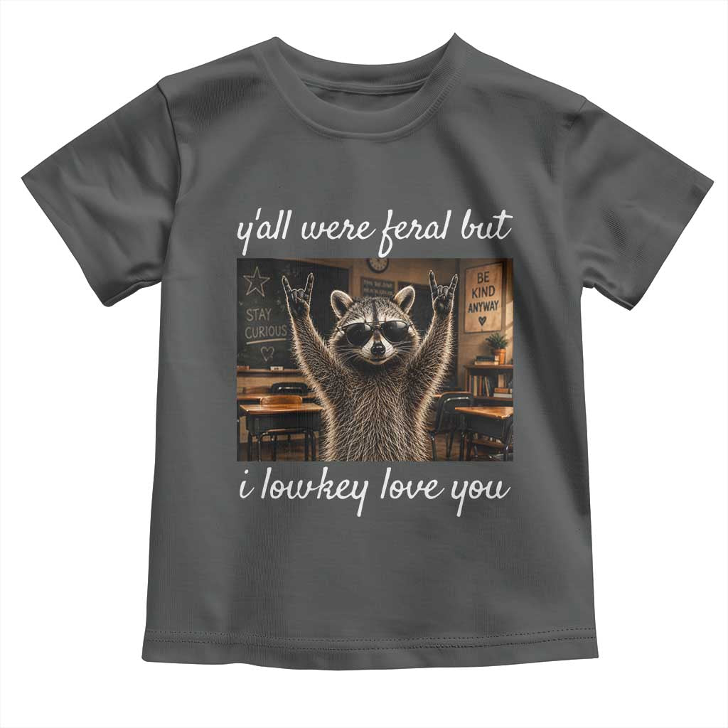 Y'all Were Feral But I Lowkey Love You Toddler T Shirt Funny Raccoon Teacher TS11 Dark Heather Print Your Wear