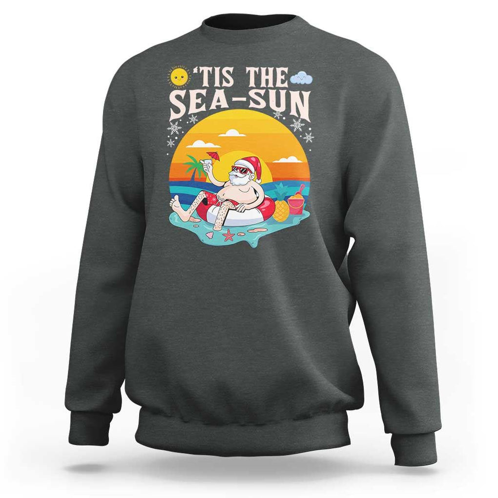 Funny Christmas In July Sweatshirt Tis The Sea Sun Santa Beach Summer Season Xmas TS11 Dark Heather Print Your Wear