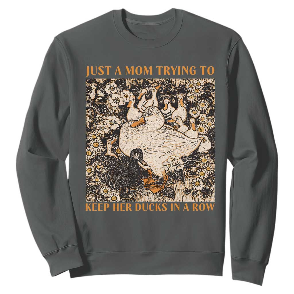 Just A Mom Trying To Keep Her Ducks In A Row Sweatshirt Funny Duck Mom TS11 Dark Heather Print Your Wear