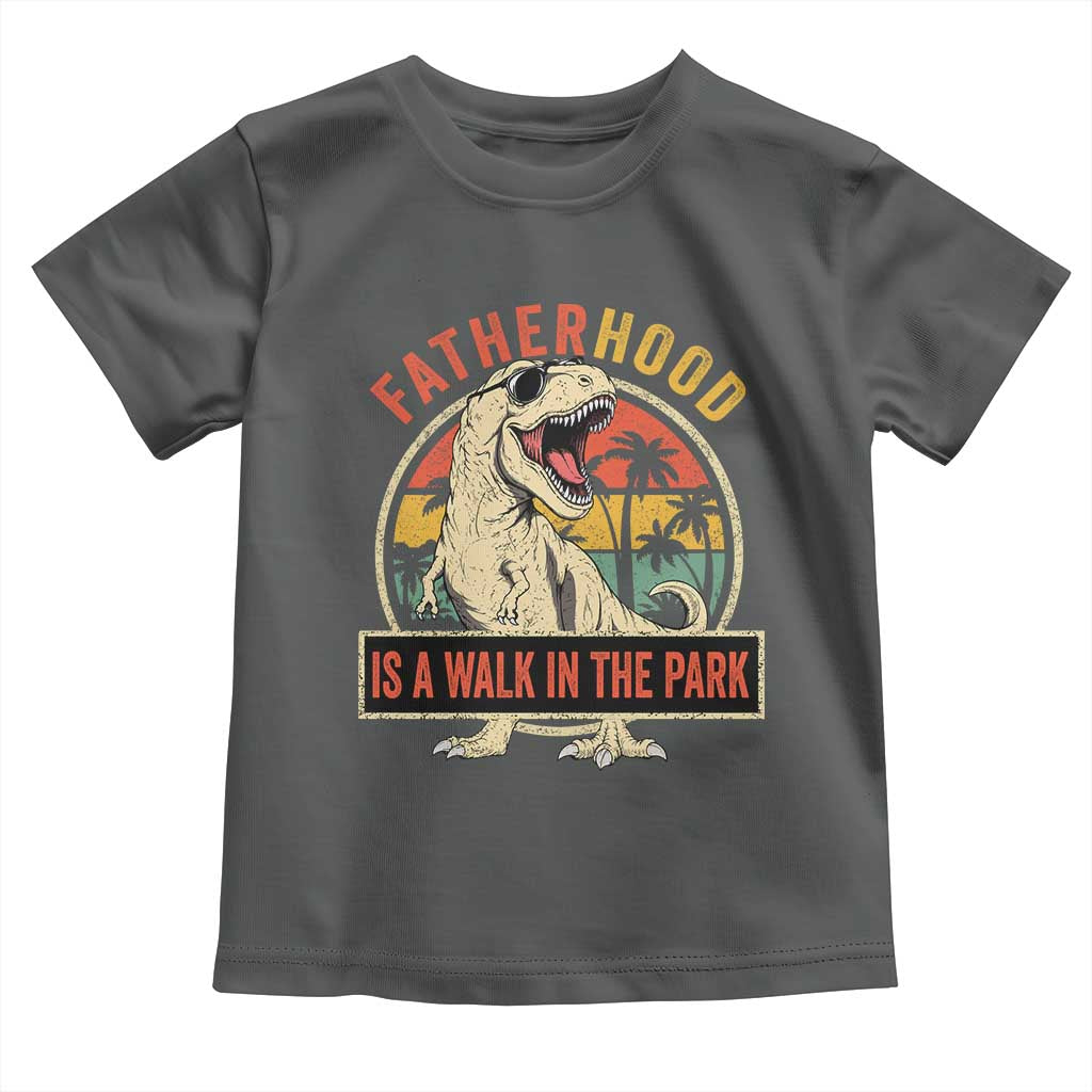 Fatherhood Is A Walk In The Park Dinosaur Dad Toddler T Shirt TS11 Dark Heather Print Your Wear