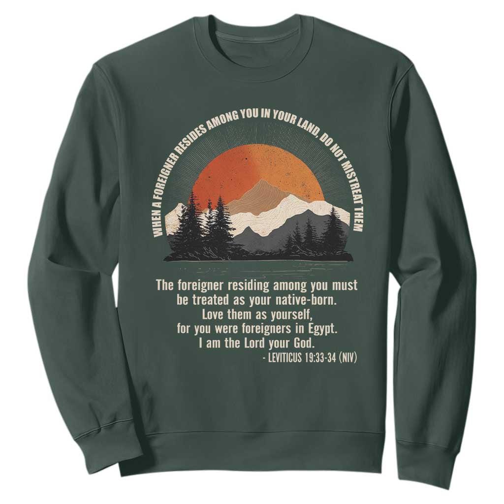 When A Foreigner Resides Among You In Your Land Do Not Mistreat Them Sweatshirt Leviticus Bible Verse TS11 Dark Forest Green Print Your Wear