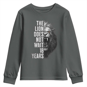 Funny The Lion Does Not Wait 18 Years Youth Sweatshirt Lion Meme Gen Z Alpha TS11 Dark Heather Print Your Wear