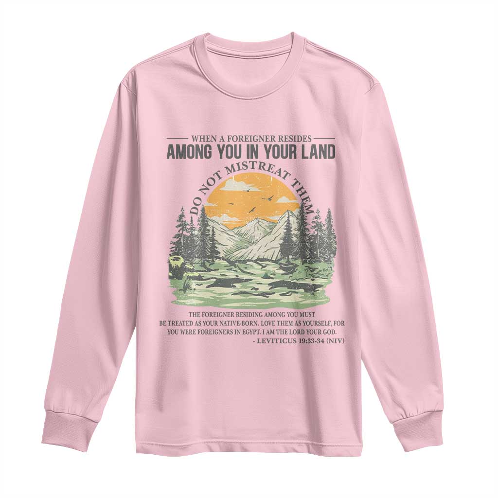 When A Foreigner Resides Among You In Your Land Do Not Mistreat Them Long Sleeve Shirt Bible Verse TS11 Light Pink Print Your Wear