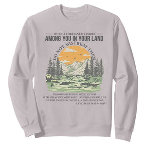 When A Foreigner Resides Among You In Your Land Do Not Mistreat Them Sweatshirt Bible Verse TS11 Ice Gray Print Your Wear