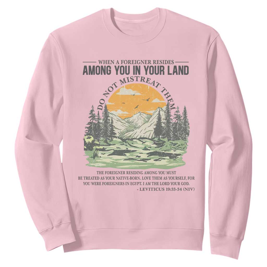 When A Foreigner Resides Among You In Your Land Do Not Mistreat Them Sweatshirt Bible Verse TS11 Light Pink Print Your Wear