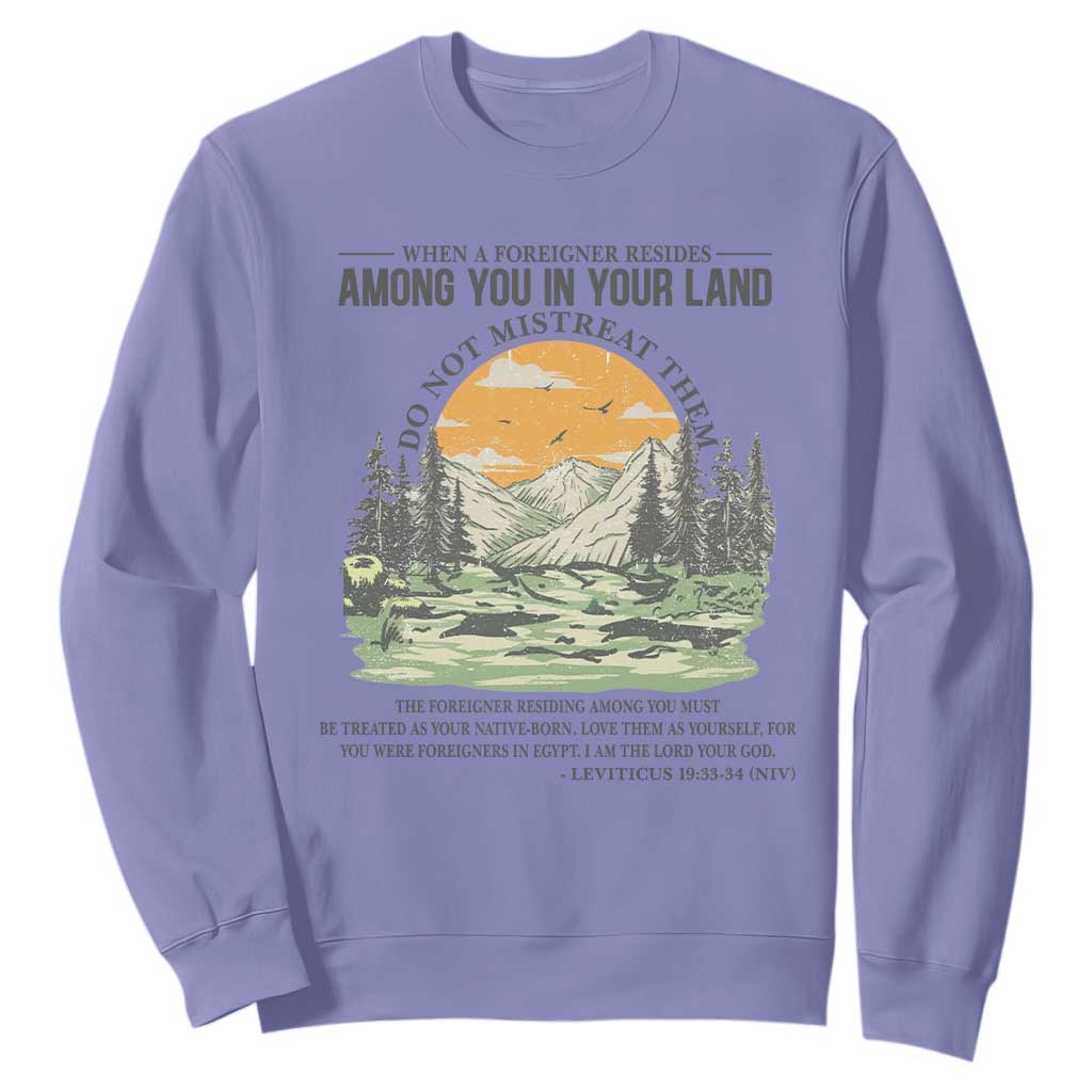 When A Foreigner Resides Among You In Your Land Do Not Mistreat Them Sweatshirt Bible Verse TS11 Violet Print Your Wear