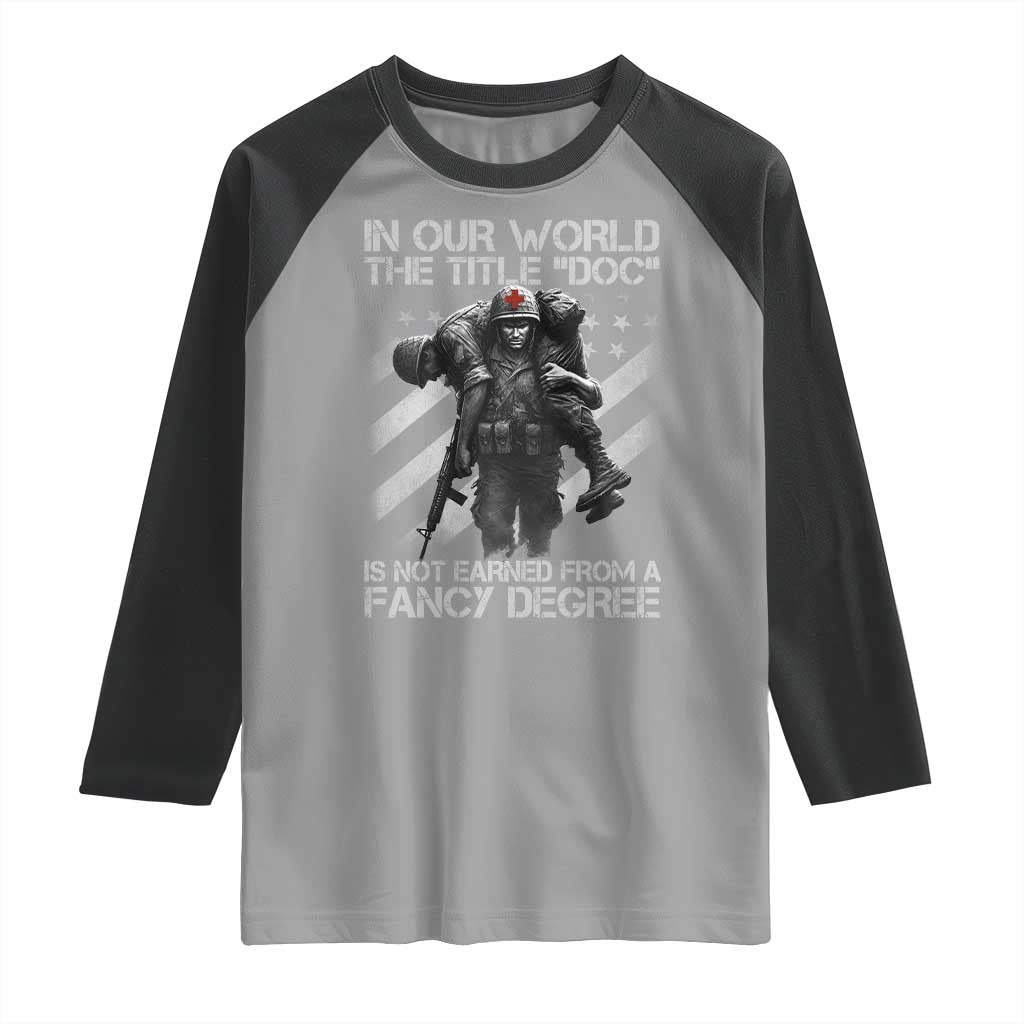 Combat Medic Raglan Shirt In Our World The Title Doc Is Not Earned Form A Fancy Degree TS11 Sport Gray Black Print Your Wear