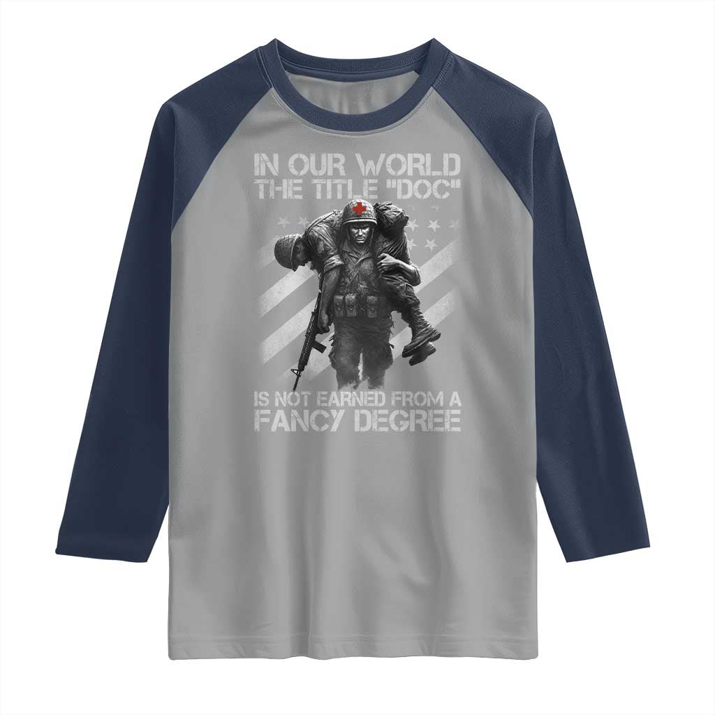 Combat Medic Raglan Shirt In Our World The Title Doc Is Not Earned Form A Fancy Degree TS11 Sport Gray Navy Print Your Wear