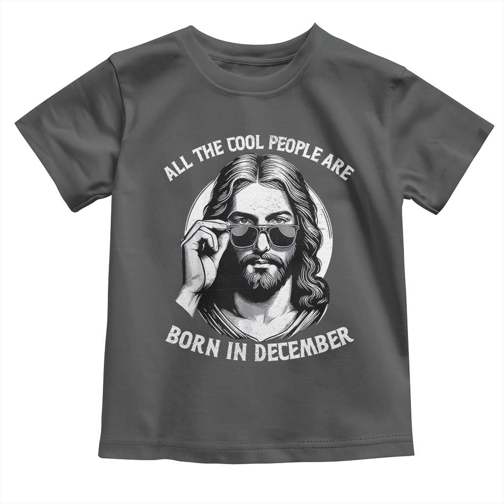 All The Cool People Are Born In December Toddler T Shirt Funny Christmas December Birthday Jesus TS11 Dark Heather Print Your Wear
