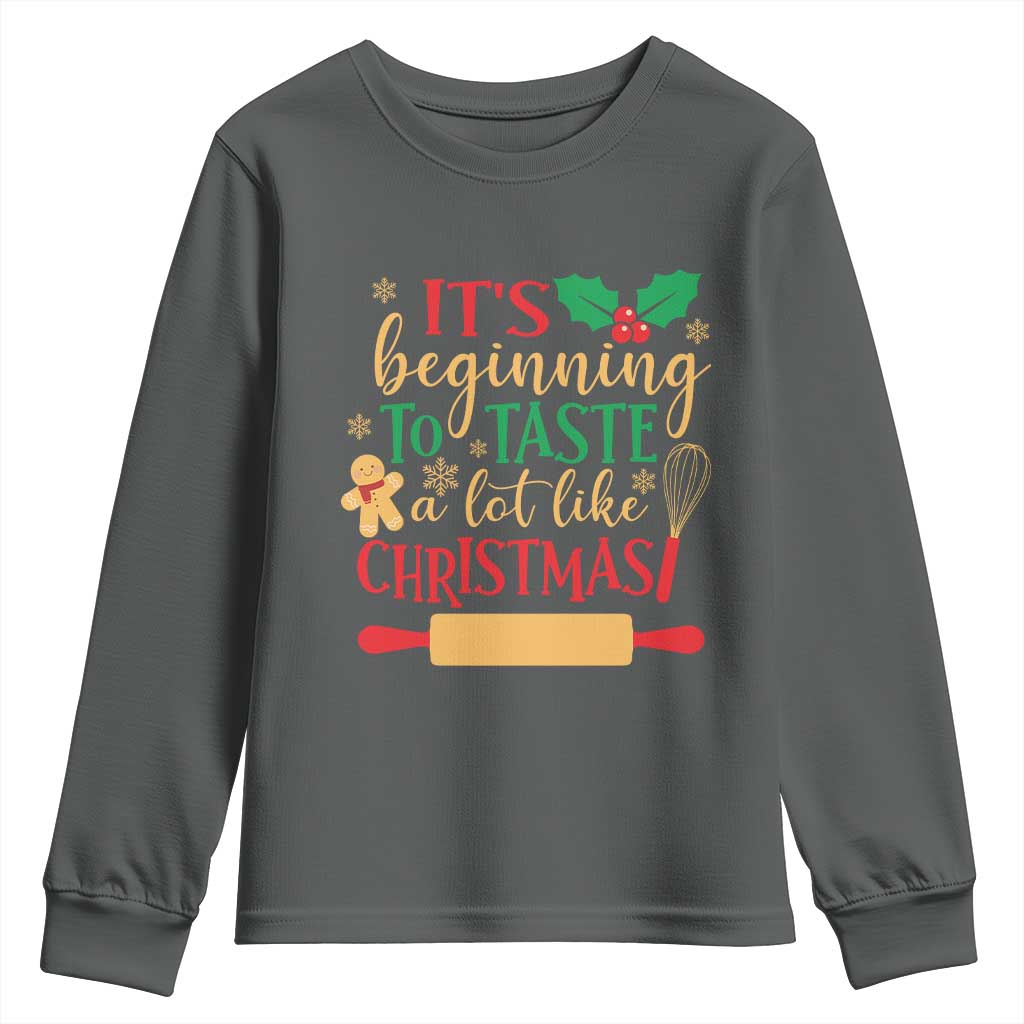 Funny Christmas Baker Youth Sweatshirt It's Beginning To Taste A Lot Like Christmas Gingerbread TS11 Dark Heather Print Your Wear