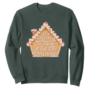 Funny Christmas Cookie Baking Sweatshirt It's Beginning To Taste A Lot Like Christmas Gingerbread House TS11 Dark Forest Green Print Your Wear