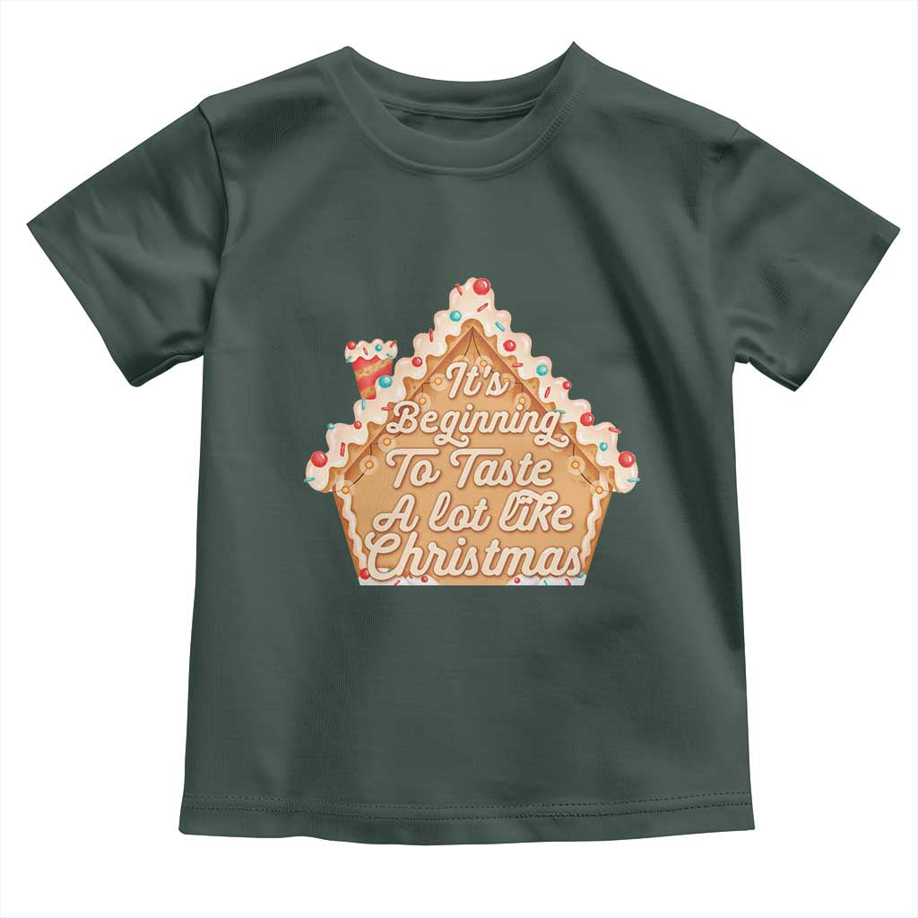 Funny Christmas Cookie Baking Toddler T Shirt It's Beginning To Taste A Lot Like Christmas Gingerbread House TS11 Dark Forest Green Print Your Wear