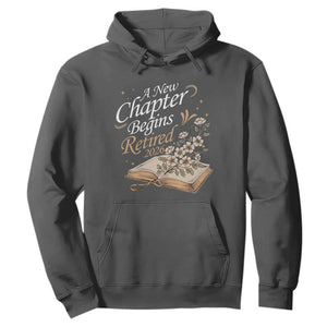 A New Chapter Begins Retired 2026 Hoodie Retired Teacher Floral Book TS11 Dark Heather Print Your Wear