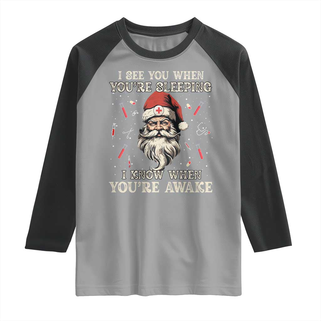 Funny Christmas Santa Doctor Medical Raglan Shirt I See You When You're Sleeping I Know When You're Awake TS11 Sport Gray Black Print Your Wear