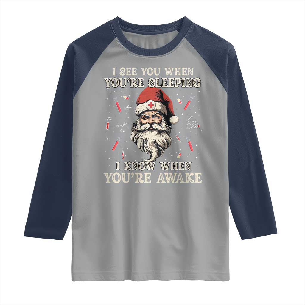 Funny Christmas Santa Doctor Medical Raglan Shirt I See You When You're Sleeping I Know When You're Awake TS11 Sport Gray Navy Print Your Wear