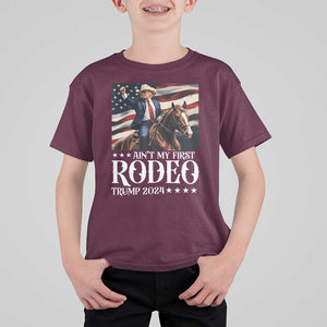 Funny Ain't My First Rodeo Trump 2024 T Shirt For Kid Western Cowboy American Flag TS11 Maroon Print Your Wear
