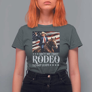 Funny Ain't My First Rodeo Trump 2024 T Shirt For Women Western Cowboy American Flag TS11 Dark Heather Print Your Wear