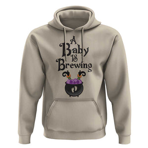 Funny Halloween Pregnancy Announcement Hoodie A Baby Is Brewing Witch Cauldron Footprint Pregnant Baby TS11 Sand Print Your Wear