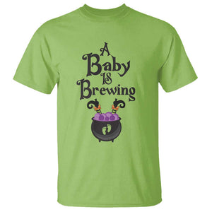 Funny Halloween Pregnancy Announcement T Shirt A Baby Is Brewing Witch Cauldron Footprint Pregnant Baby TS11 Lime Print Your Wear