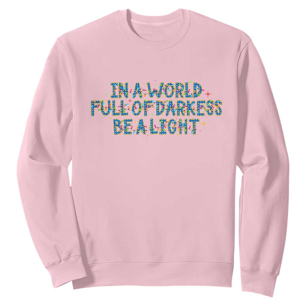 In A World Full Of Darkness Be A Light Sweatshirt Christmas Quote Gift TS12 Light Pink Print Your Wear