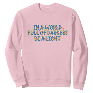 In A World Full Of Darkness Be A Light Sweatshirt Christmas Quote Gift TS12 Light Pink Print Your Wear