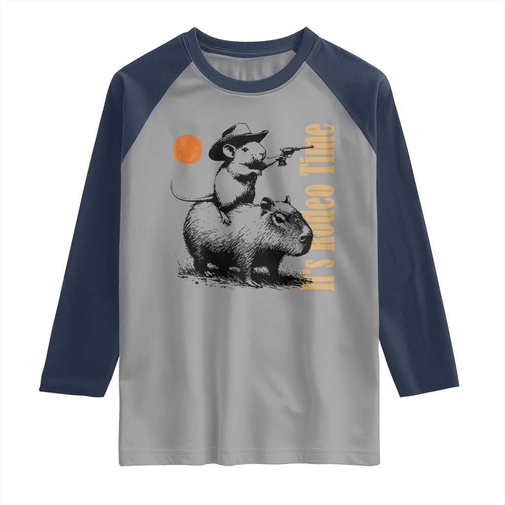 It Is Rodeo Time Raglan Shirt Funny Wild West Mouse Riding Capybara TS12 Sport Gray Navy Print Your Wear