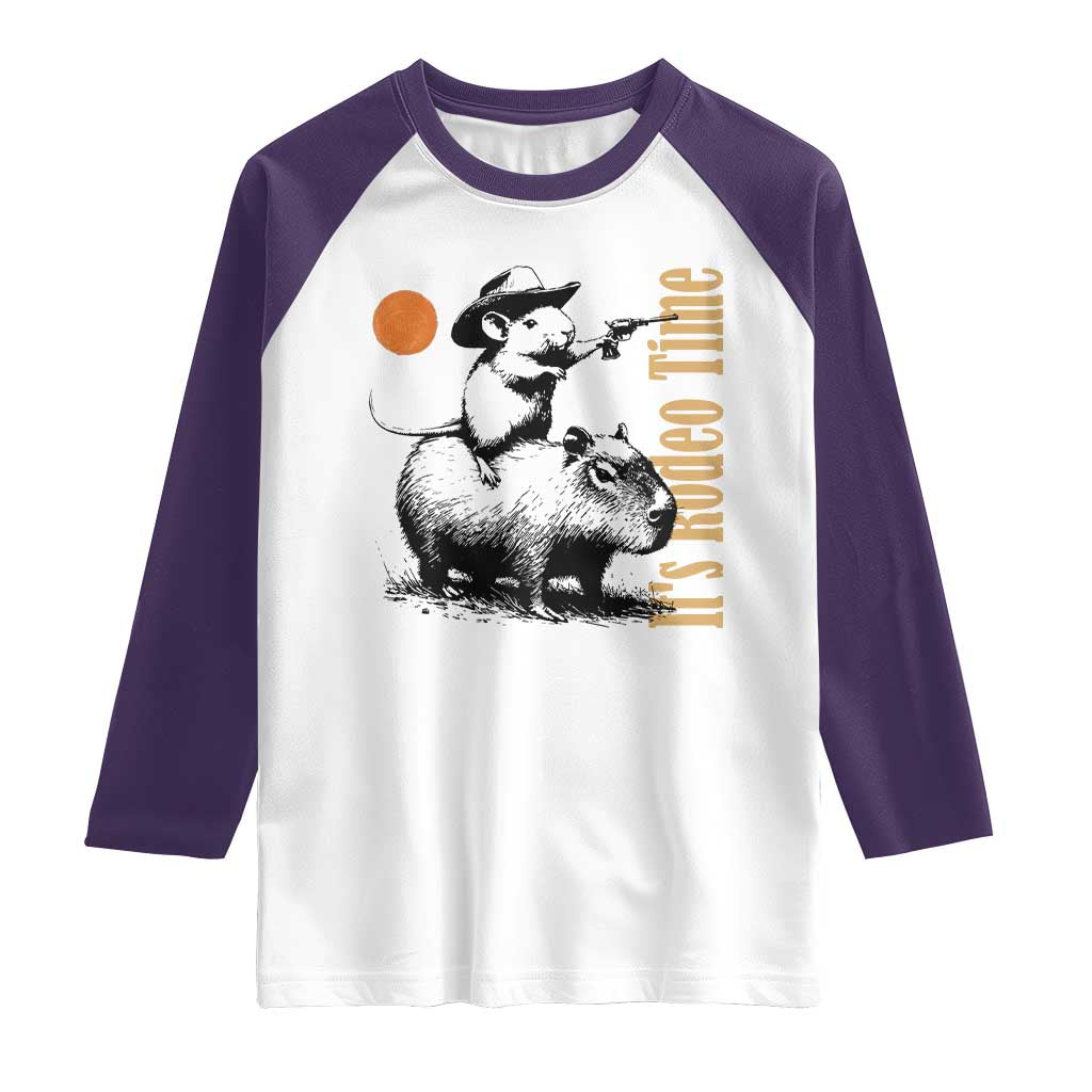 It Is Rodeo Time Raglan Shirt Funny Wild West Mouse Riding Capybara TS12 White Purple Print Your Wear